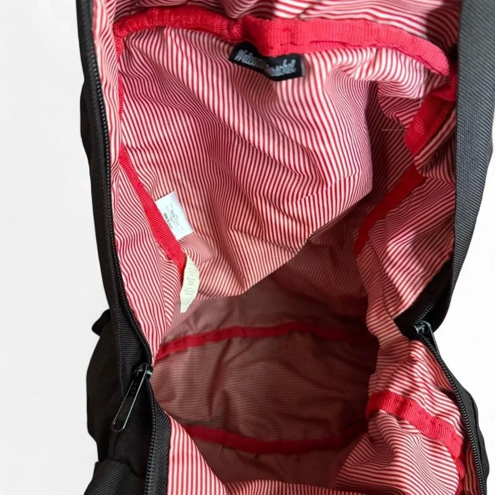 Herschel black backpack with red and white striped interior